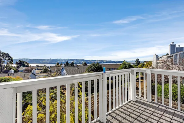 a view of a balcony with city view