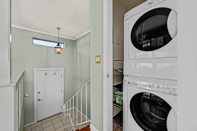 a view of a hallway with washer and dryer
