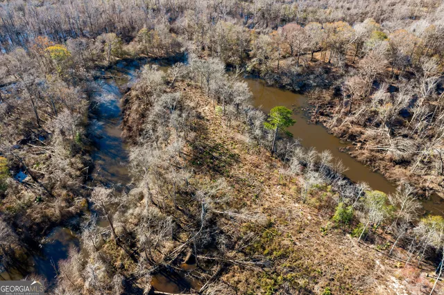 a view of a lake with boats and ocean view