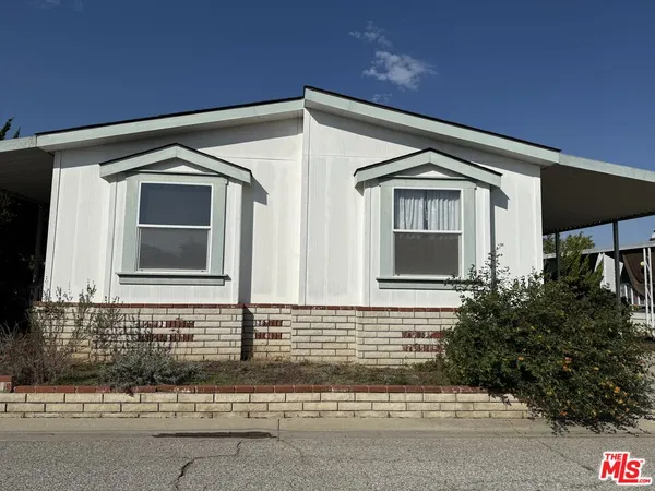 a front view of a house with garage