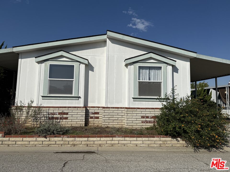 a front view of a house with garage