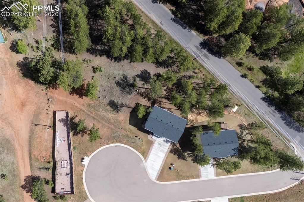 1396 Roberts Ranch Road Woodland Park, CO 80863 - Photo 15 of 15 an aerial view of a house with a yard basket ball court and outdoor seating