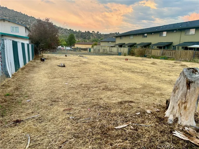 a swimming pool with outdoor seating and yard