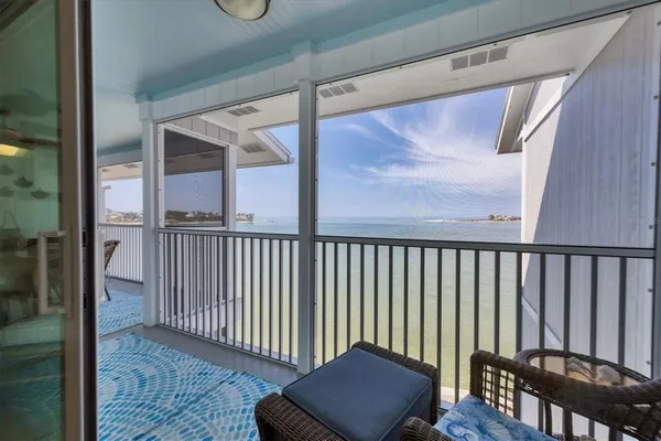 a view of a porch with wooden floor