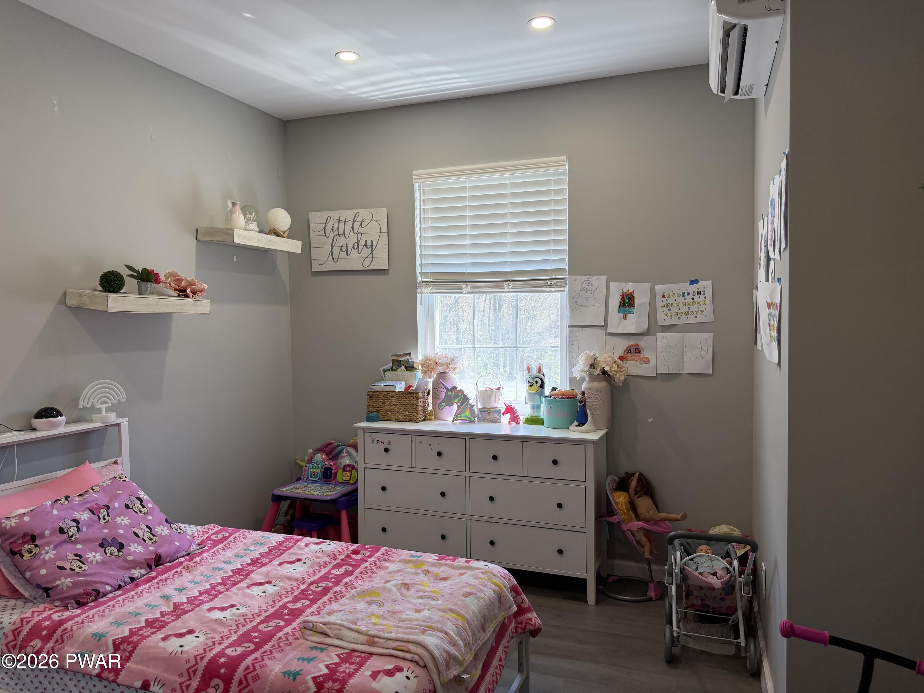 801 Maple Ridge Court Hawley, PA 18428 - Photo 38 of 55 a bedroom with a bed and a window