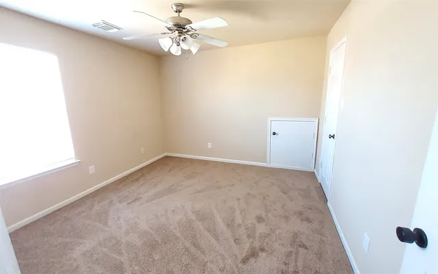 a bathroom with a sink mirror vanity and toilet
