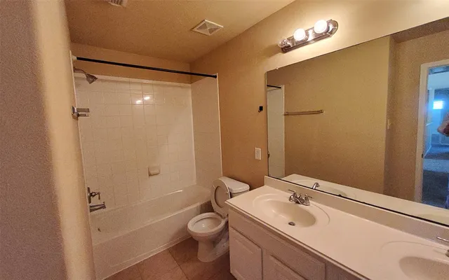 a room with wooden floor and furniture