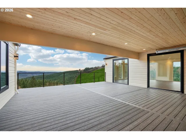 a view of an empty room with windows