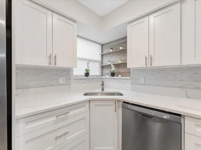a kitchen with a sink and cabinets