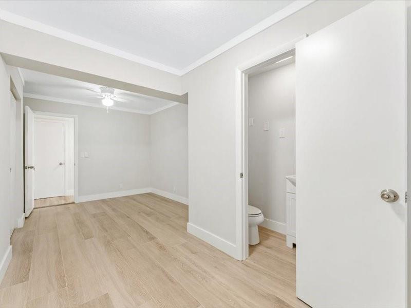 311 West Sample Road Deerfield Beach, FL 33064 - Photo 18 of 34 a bathroom with a sink and a toilet