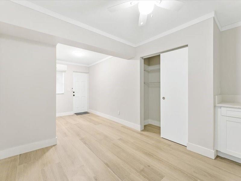 311 West Sample Road Deerfield Beach, FL 33064 - Photo 19 of 34 wooden floor in an empty room