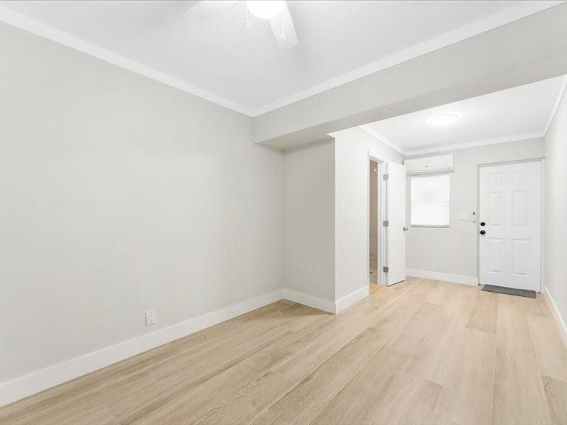 311 West Sample Road Deerfield Beach, FL 33064 - Photo 20 of 34 wooden floor in an empty room