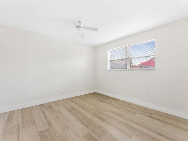 311 West Sample Road Deerfield Beach, FL 33064 - Photo 22 of 34 an empty room with a window