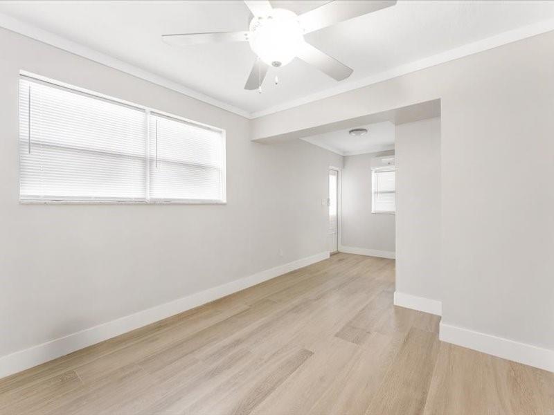 311 West Sample Road Deerfield Beach, FL 33064 - Photo 24 of 34 an empty room with a window and a fan