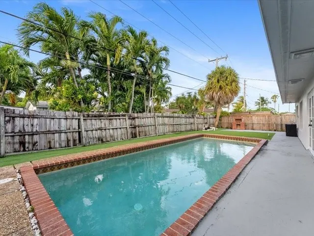 a view of a backyard with a small pool