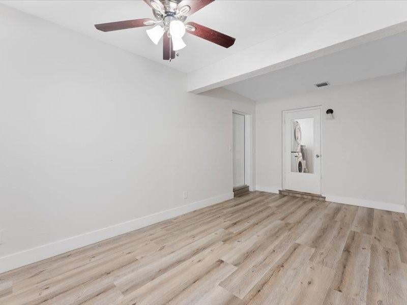 311 West Sample Road Deerfield Beach, FL 33064 - Photo 9 of 34 wooden floor in an empty room