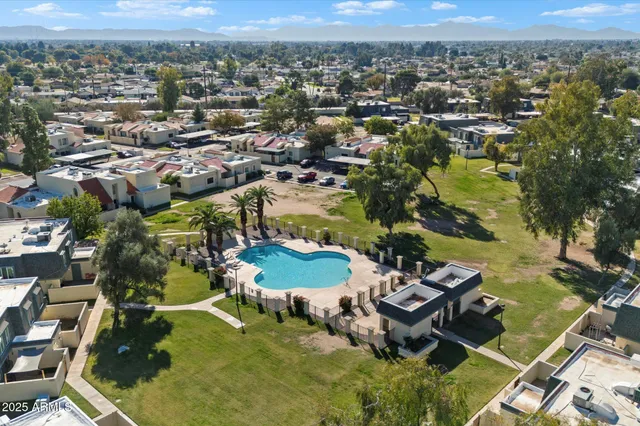 an aerial view of a house with a lake view