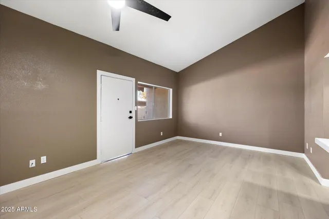 a view of an empty room with a window