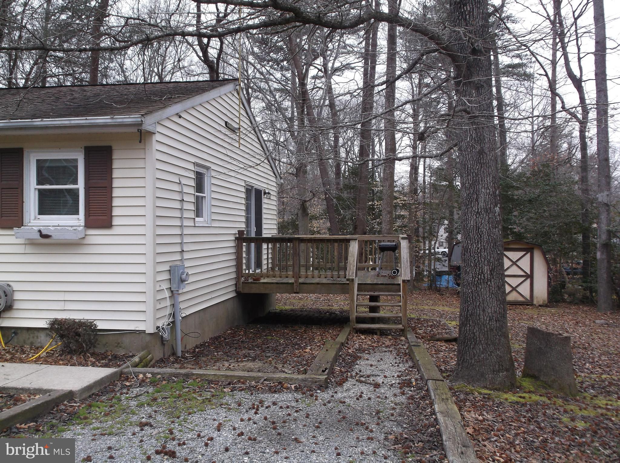 11575 Big Sandy Run Road Lusby, MD 20657 - Photo 3 of 30 Gravel drive and deck off kitchen