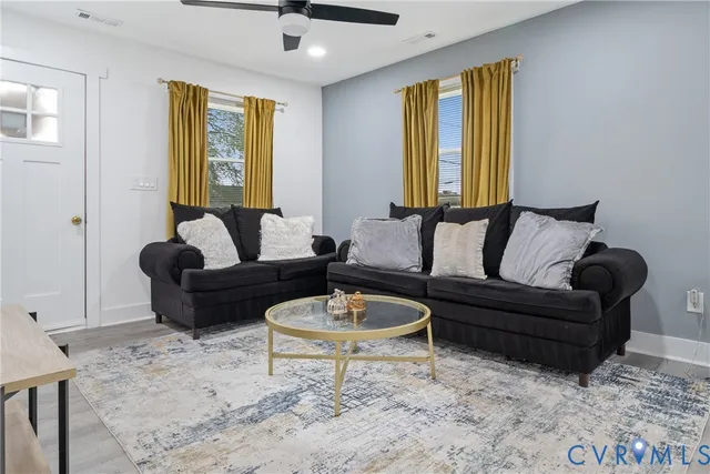 a living room with furniture and a window