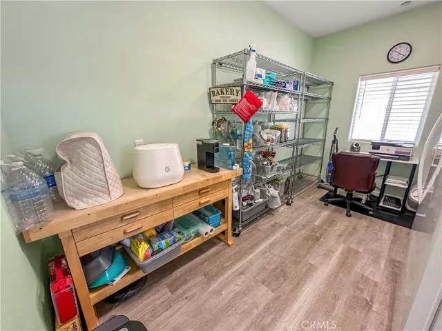 a bedroom with furniture and a flat screen tv