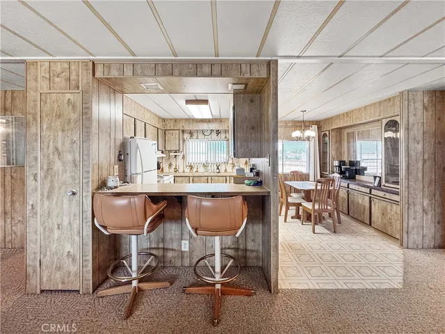 a dining room with a table and chairs