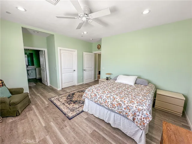 a bedroom with a bed dresser and a window