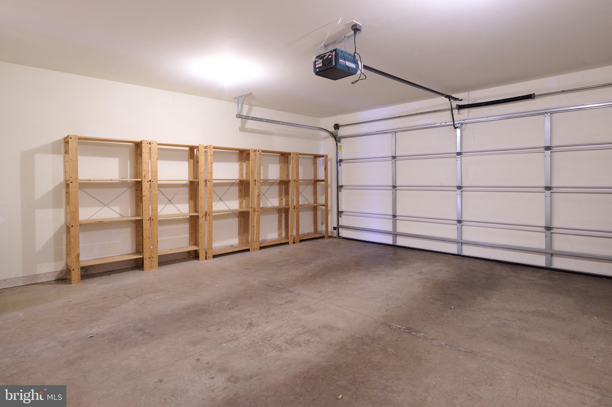 3222 Shellers Bend, Unit 209 State College, PA 16801 - Photo 28 of 76 Garage with storage shelves