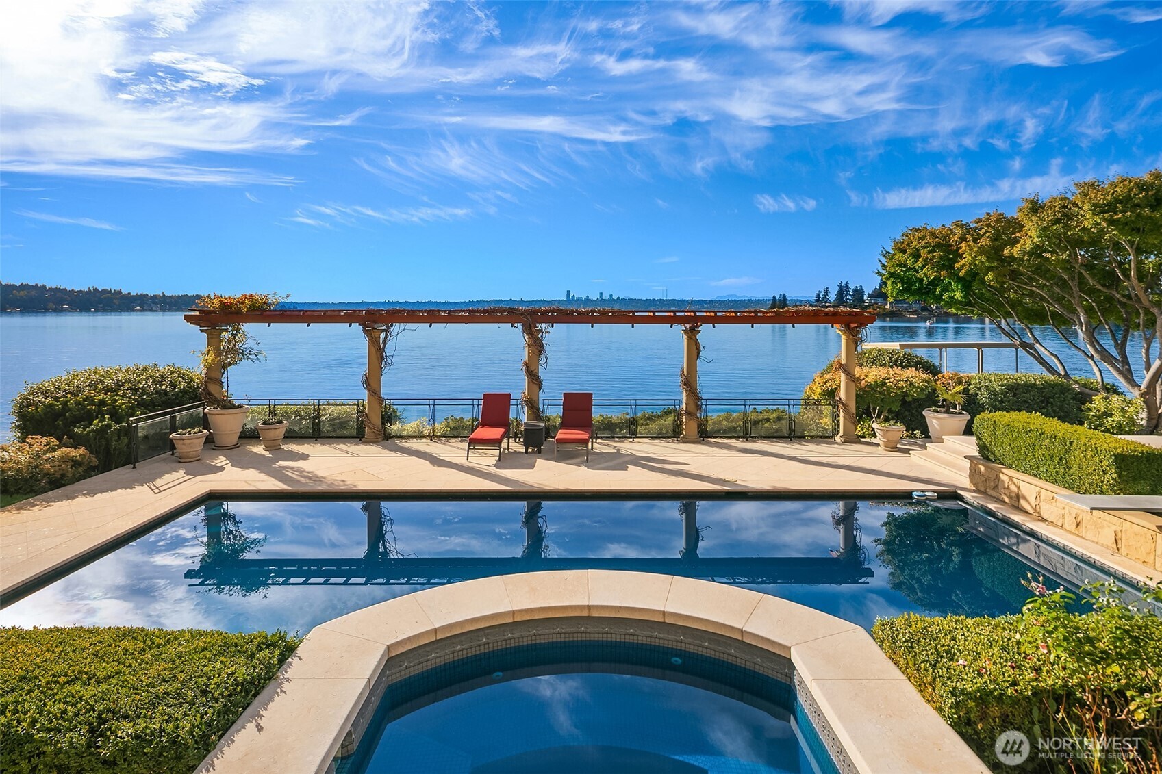 a view of swimming pool with outdoor seating