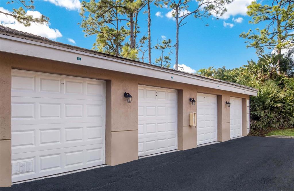 4248 Southeast Cove Lake Circle, Unit 3B06207 Stuart, FL 34997 - Photo 17 of 18 a view of a house with a garage