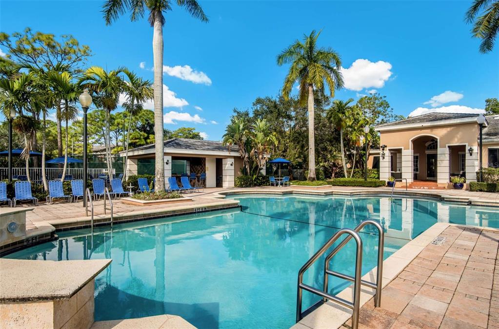 4248 Southeast Cove Lake Circle, Unit 3B06207 Stuart, FL 34997 - Photo 7 of 18 a view of a swimming pool with a patio