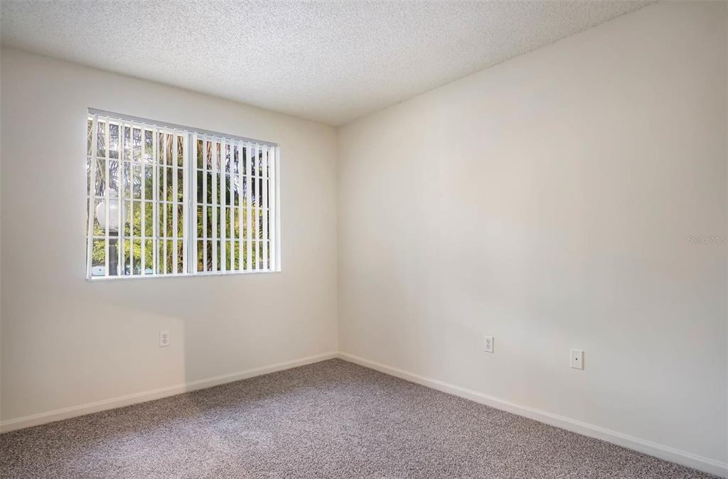 4248 Southeast Cove Lake Circle, Unit 3B06207 Stuart, FL 34997 - Photo 10 of 18 an empty room with a window