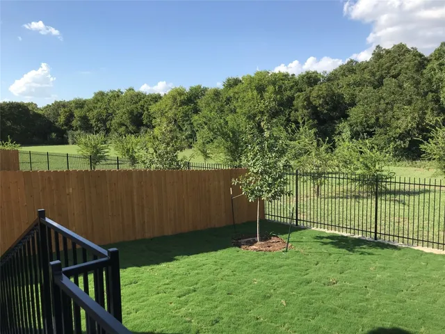 a view of a backyard with a garden