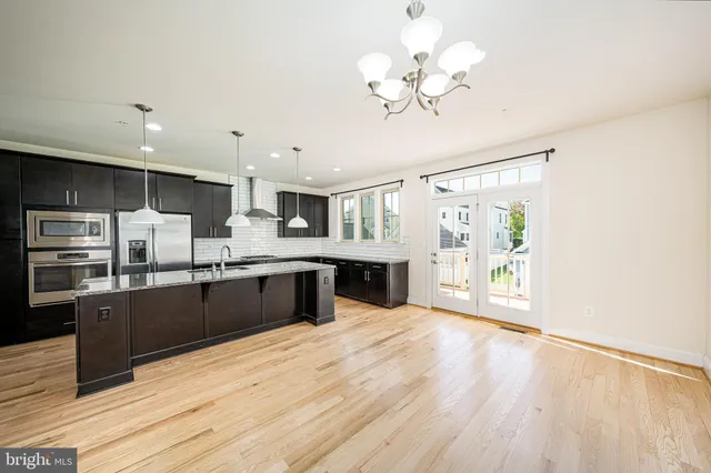a kitchen with a table and chairs