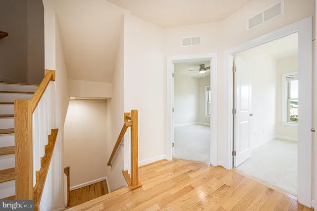 a bathroom with a granite countertop sink mirror and double