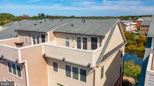 a view of a swimming pool with outdoor seating