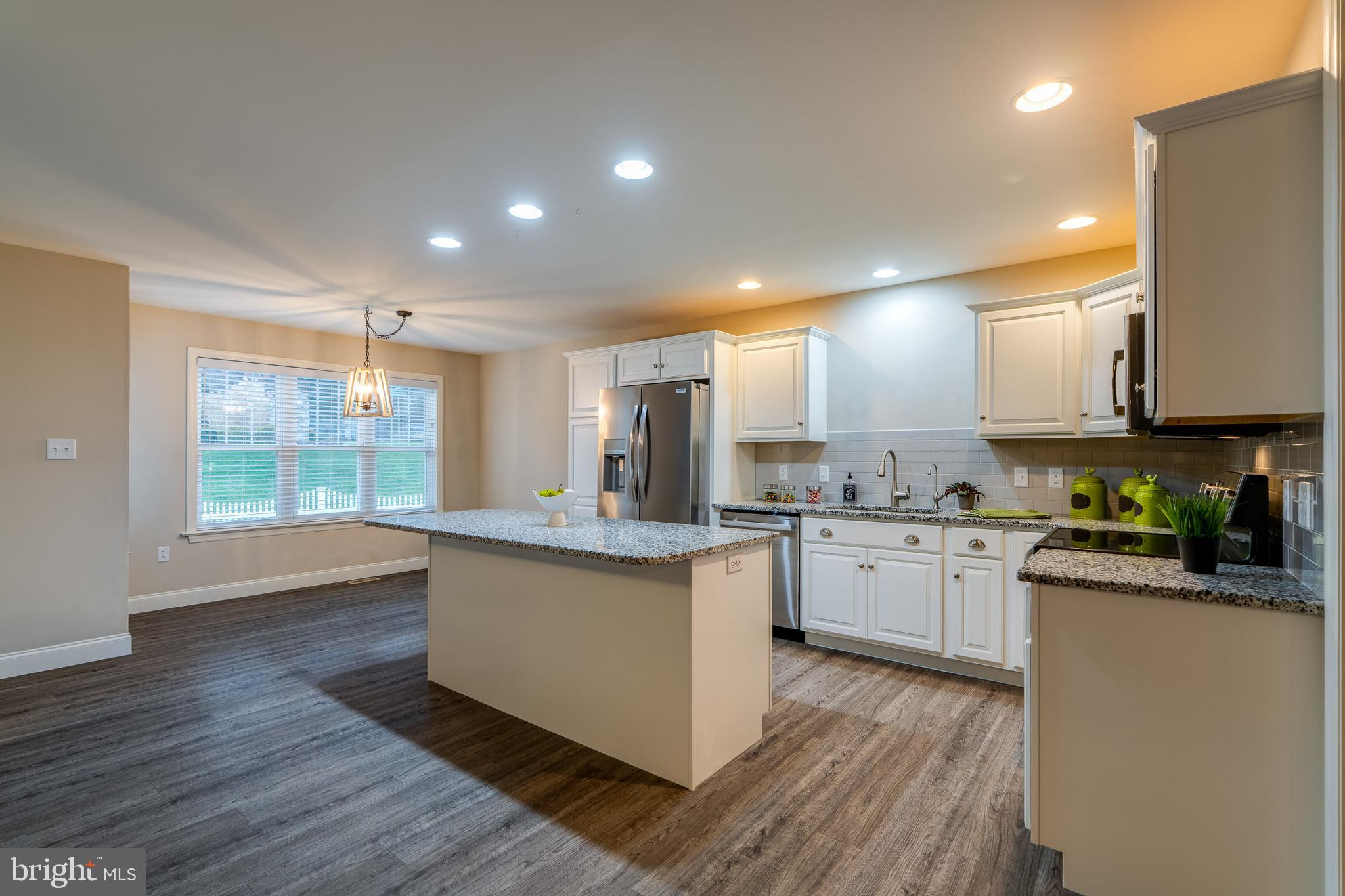 1400 Limestone Ridge Landisville, PA 17538 - Photo 15 of 50 a kitchen with stainless steel appliances granite countertop wooden cabinets a sink a stove a refrigerator and white cabinets