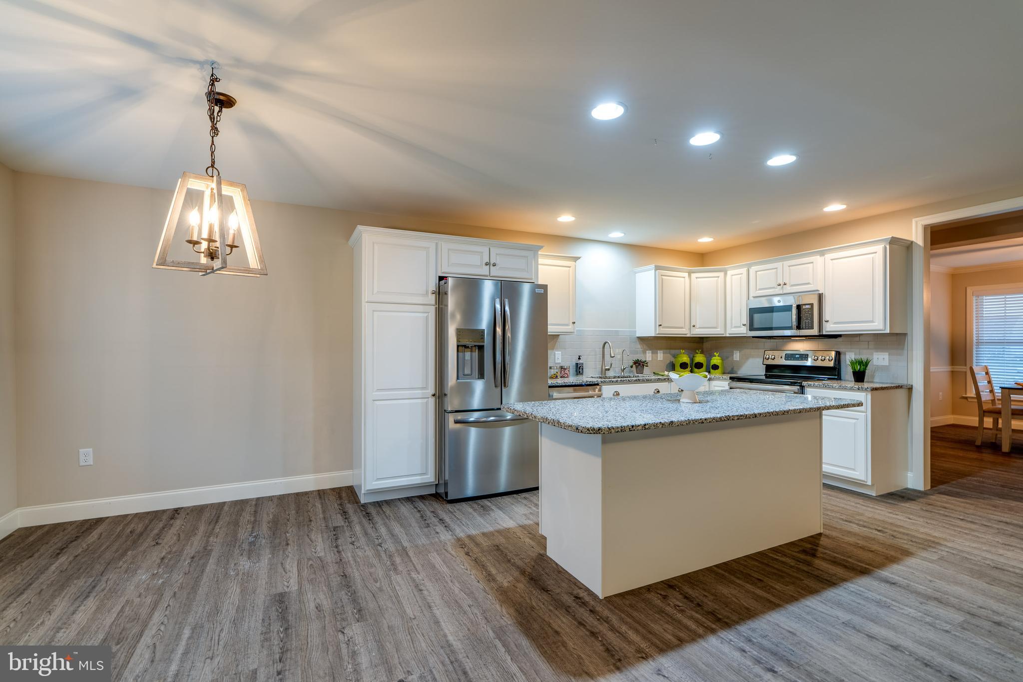 1400 Limestone Ridge Landisville, PA 17538 - Photo 16 of 50 a kitchen with stainless steel appliances granite countertop a refrigerator and a stove top oven