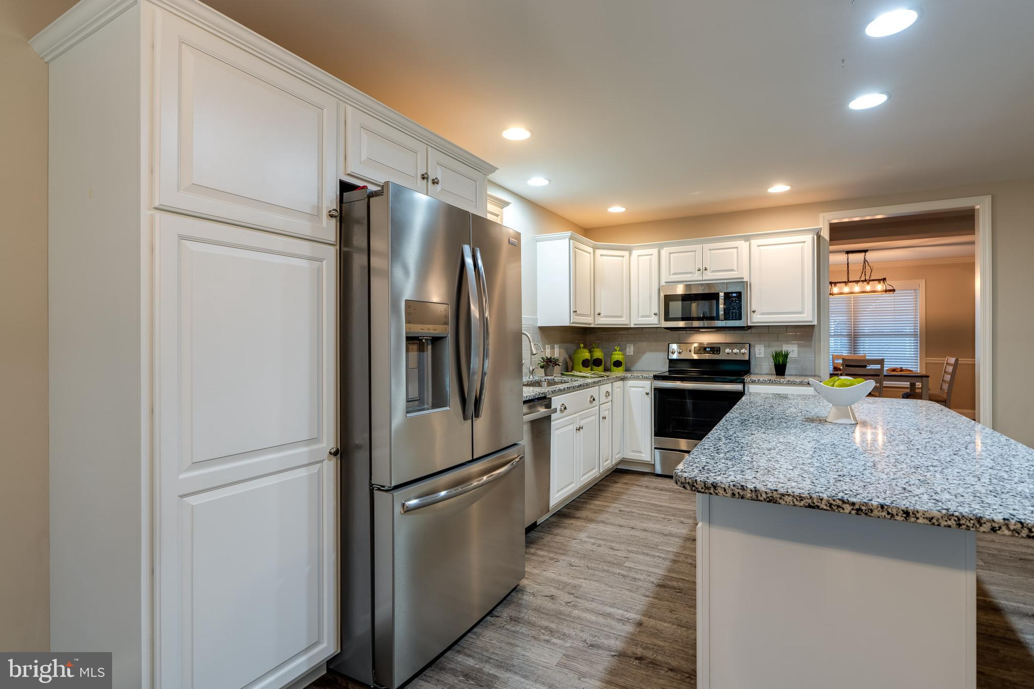 1400 Limestone Ridge Landisville, PA 17538 - Photo 17 of 50 a kitchen with granite countertop stainless steel appliances and refrigerator