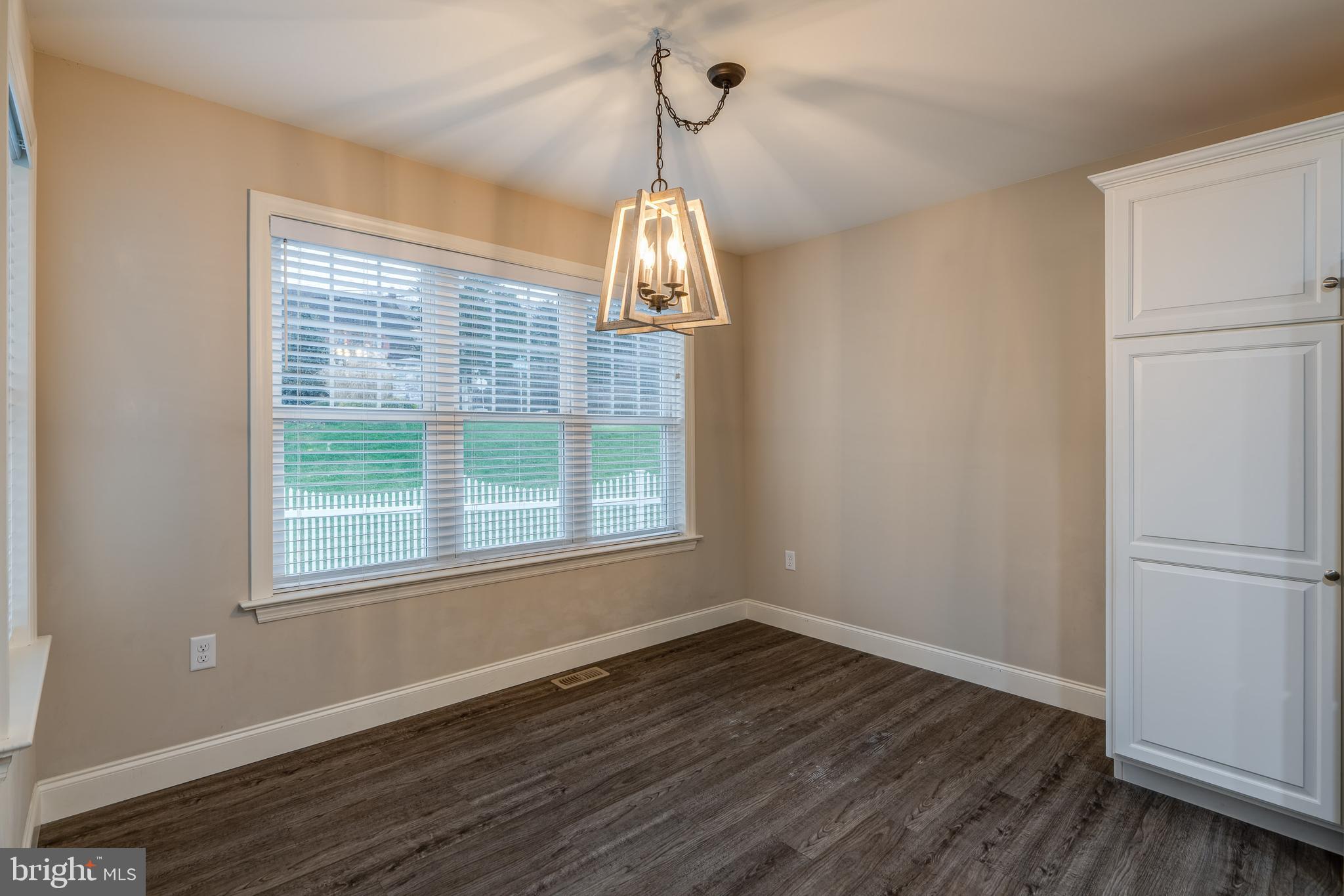 1400 Limestone Ridge Landisville, PA 17538 - Photo 20 of 50 an empty room with wooden floor cabinet and windows