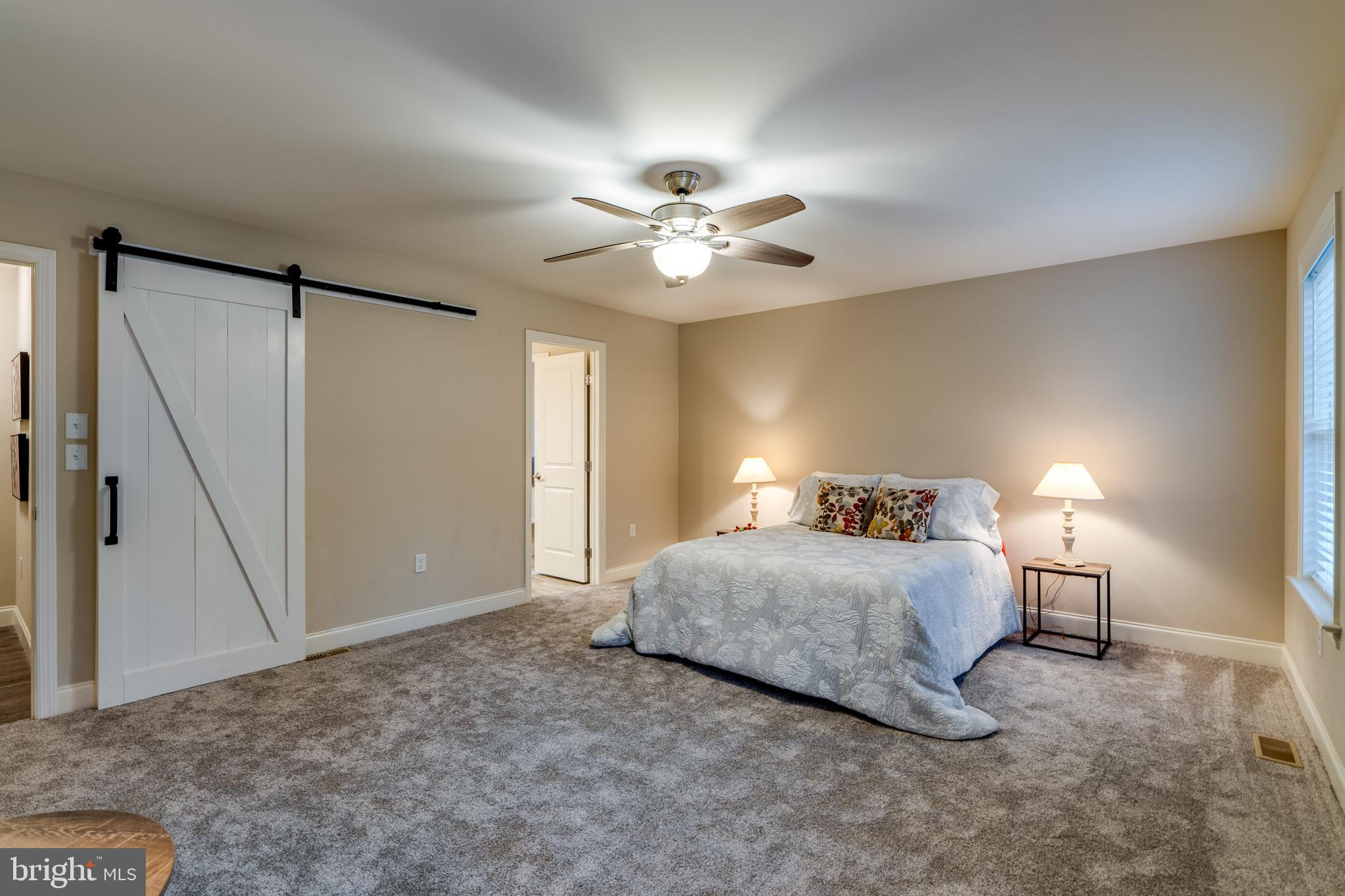 1400 Limestone Ridge Landisville, PA 17538 - Photo 24 of 50 a bedroom with a bed and a ceiling fan