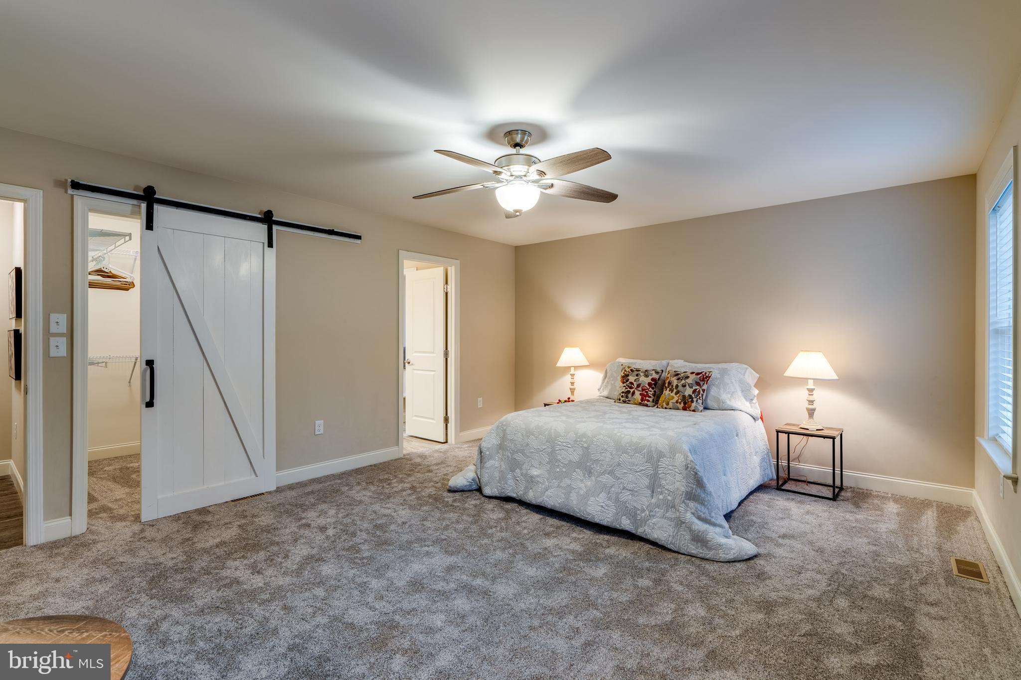 1400 Limestone Ridge Landisville, PA 17538 - Photo 26 of 50 a spacious bedroom with a bed and a chandelier