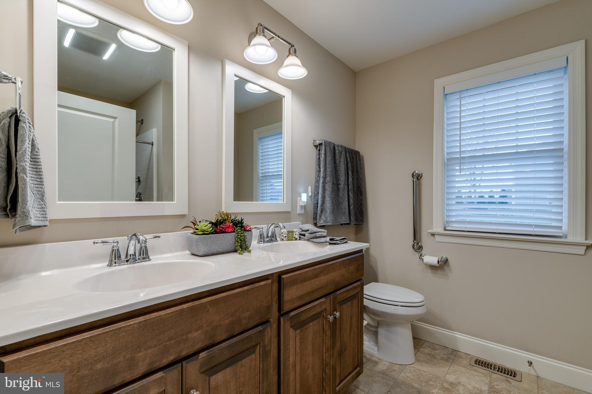 1400 Limestone Ridge Landisville, PA 17538 - Photo 37 of 50 a bathroom with a double vanity sink toilet and a mirror