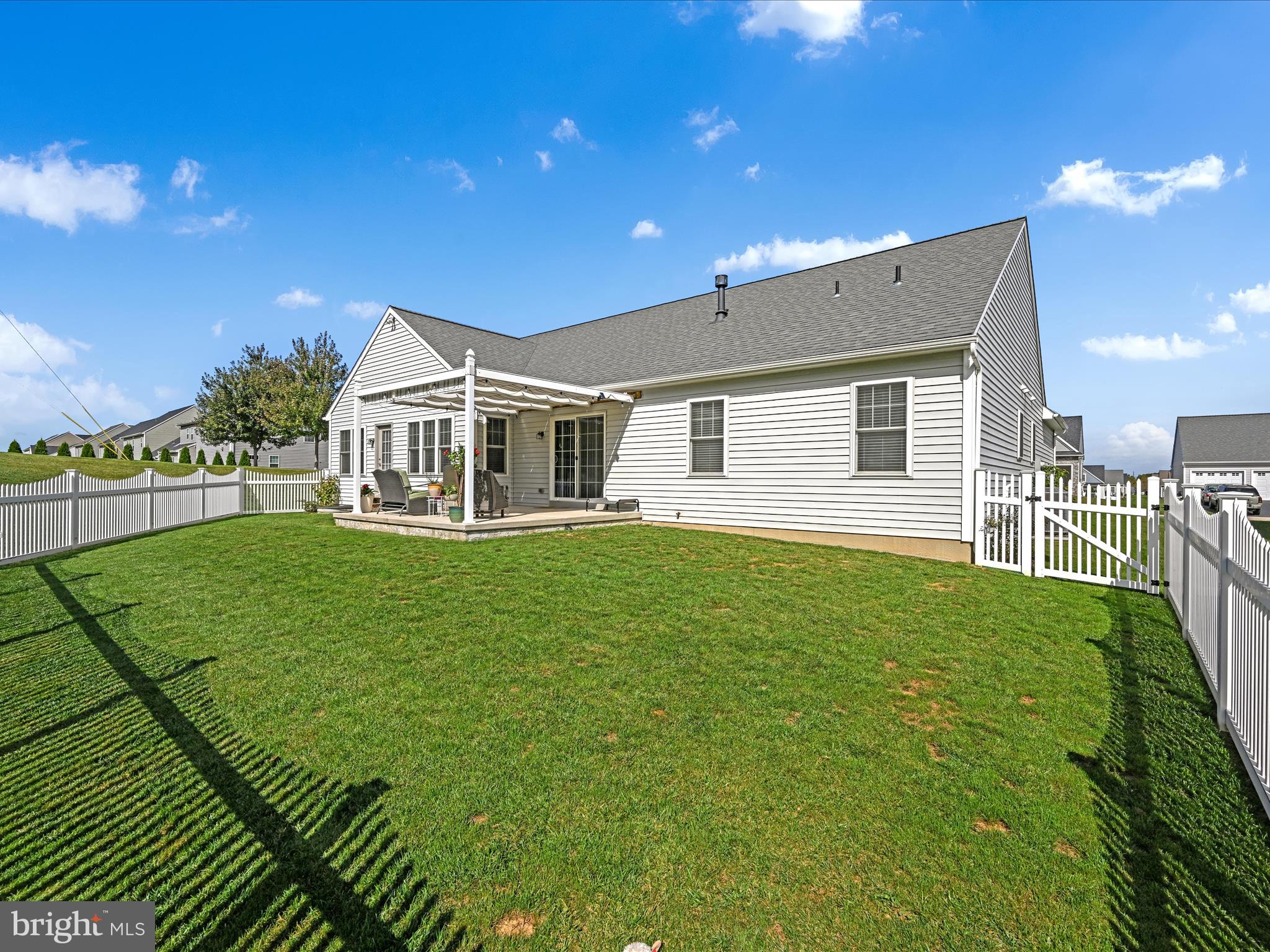 1400 Limestone Ridge Landisville, PA 17538 - Photo 44 of 50 a front view of a house with a yard table and chairs