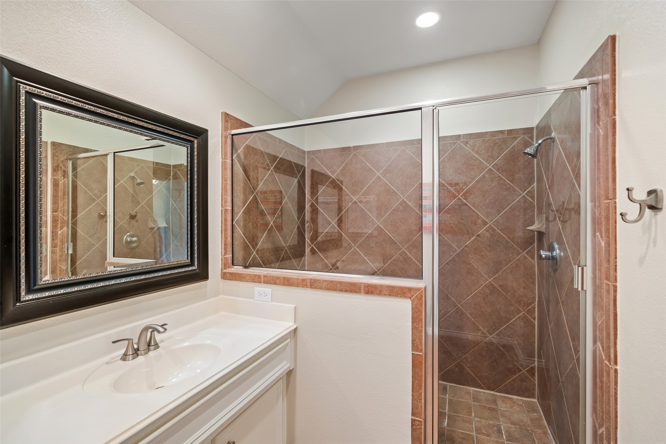 2613 Link Road Houston, TX 77009 - Photo 22 of 28 The primary bathroom offers a spacious standalone shower and dual vanity.