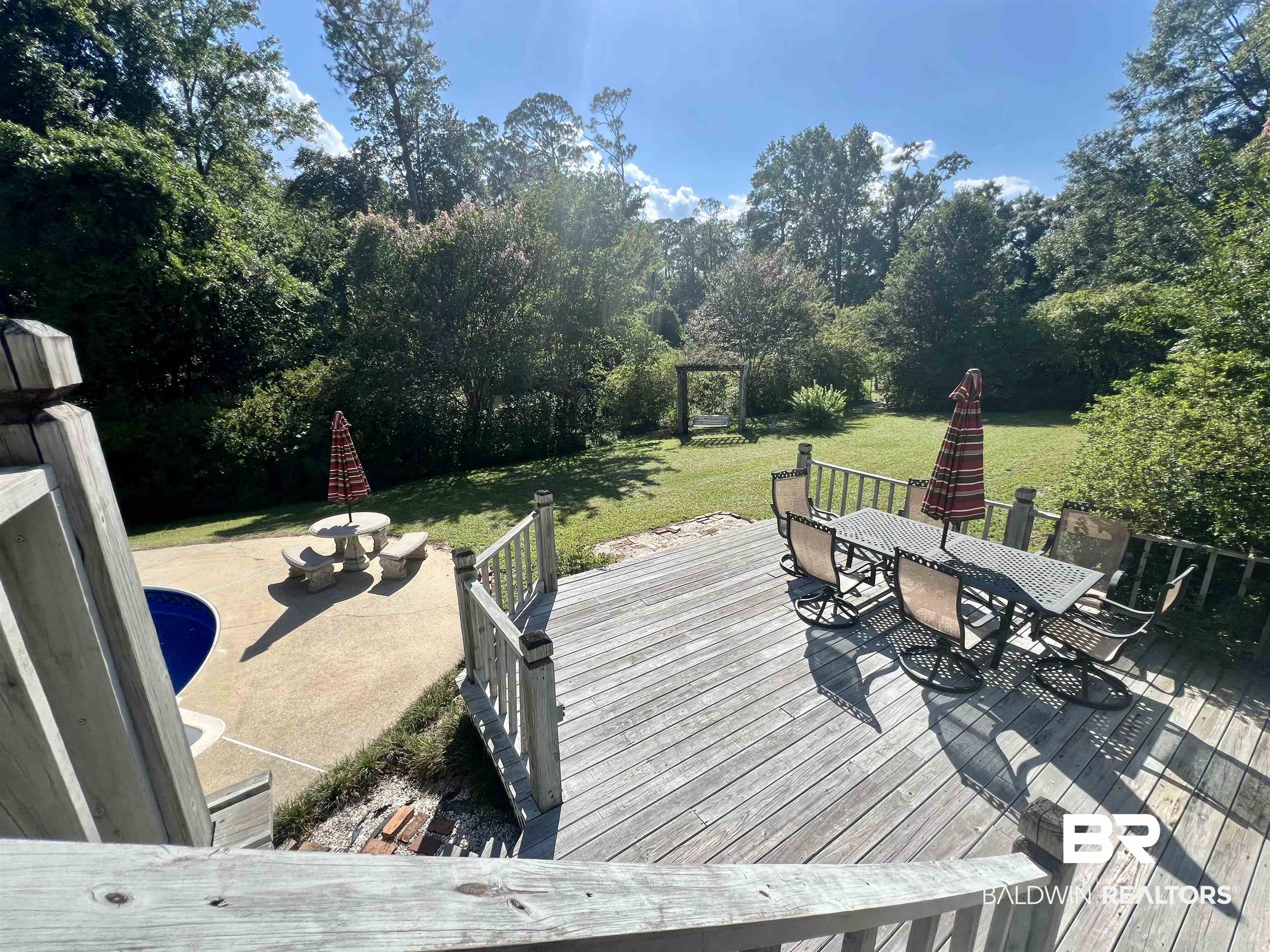 2691 Appleton Road Brewton, AL 36426 - Photo 50 of 60 Deck with outdoor dining area and a yard