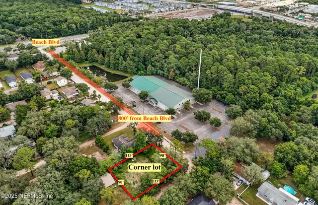 an aerial view of residential house with outdoor space and trees all around