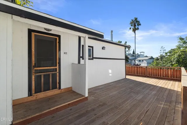 a kitchen with white cabinets and appliances
