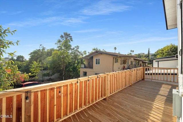 a view of balcony with wooden floor