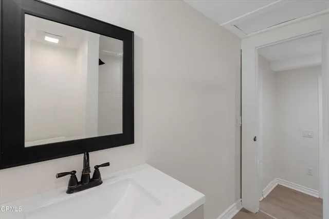 a bathroom with a sink and mirror